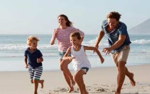 Family Running on beach 